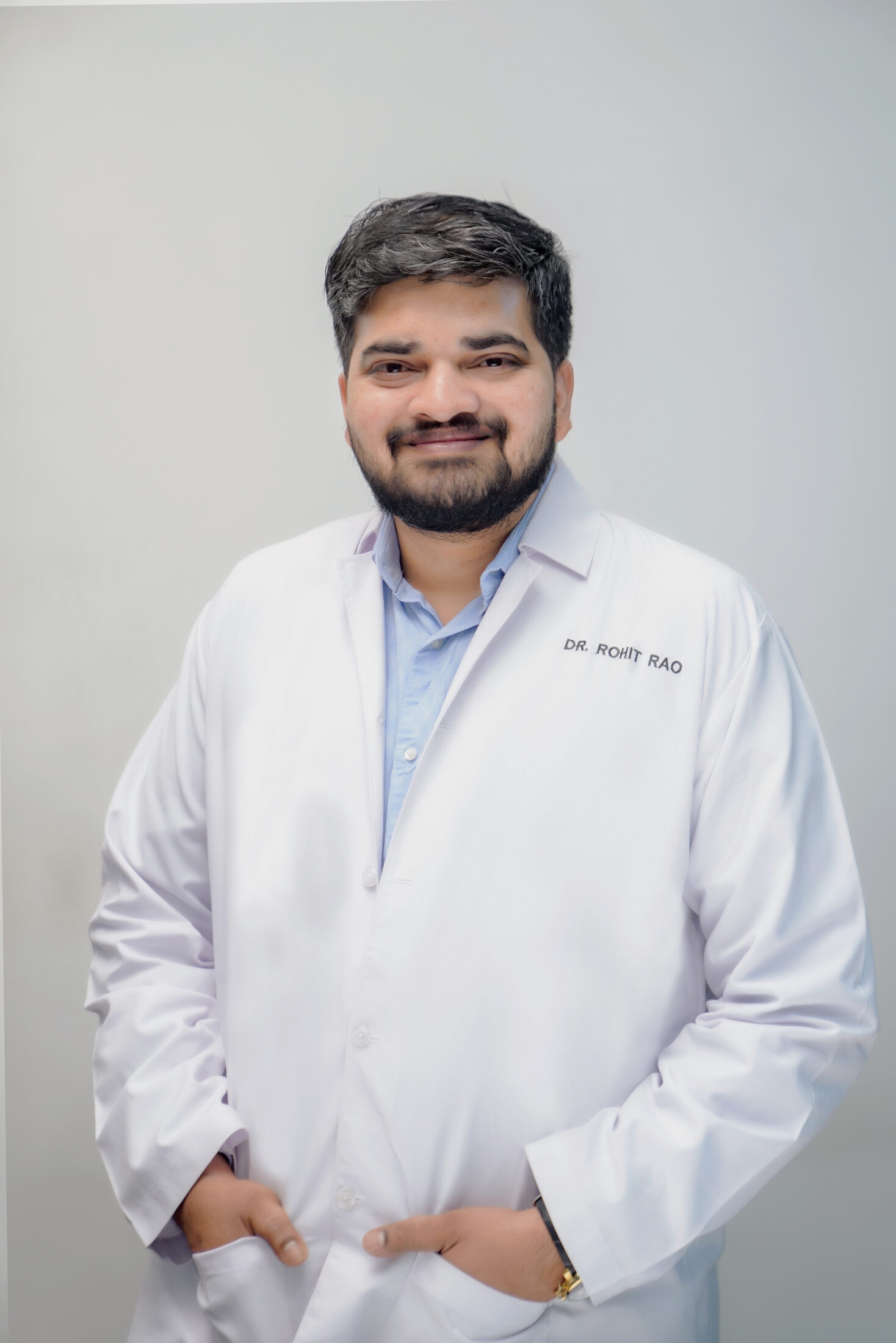 Oculoplastic surgeon examining an eyelid lesion